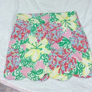 Lilly skirt, scallop edges, lined with side zipper. Gently used.